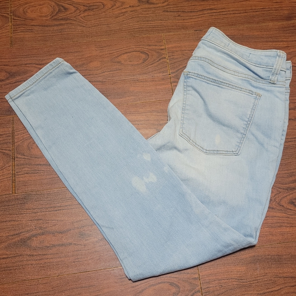 Mid rise skinny blue jeans with bleach spot design size 4/27s